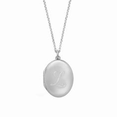 Our new, timeless oval locket necklace is an elegant way for you to carry your loved ones close to your heart. Hold pictures of your loved ones or a memento that is special to you. Engrave an initial on the front and up to 3 names/phrase on the back. available in gold vermeil and sterling silver lockets are engraved using diamond drag technology opens with space inside for 2 pictures, which fit easily inside the locket. See our guide for adding photos to your locket hangs on adjustable length ro Heirloom Locket Necklace With Oval Pendant For Anniversary, Elegant Oval Link Locket Necklace, Timeless Engraved Oval Pendant Jewelry, Timeless Engraved Oval Locket Necklace, Timeless Oval Engraved Locket Necklace, Elegant Oval Link Keepsake Necklace, Elegant Oval Link Necklace For Keepsake, Timeless Oval Keepsake Necklace, Elegant White Gold Oval Link Locket Necklace