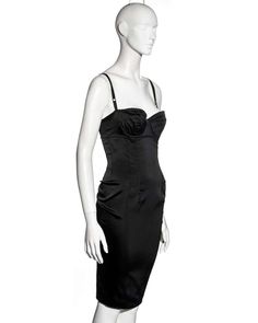 For Sale on 1stDibs - ▪ Dolce & Gabbana black evening dress ▪ Stretch satin ▪ Attached bra with adjustable shoulder straps ▪ Low back ▪ Ruched center-back seam with corset style Sleeveless Boned Corset Dress For Formal Occasions, Formal Sleeveless Corset Dress With Boning, Sleeveless Corset Dress With Boning For Formal Occasions, Black Dress With Built-in Bra For Formal Occasions, Elegant Corset Dress With Straps For Evening, Formal Sleeveless Corset Dress With Straps, Elegant Black Slip Dress With Corset Back, Black Corset Dress With Spaghetti Straps For Gala, Formal Corset Dress With Spaghetti Straps And Ruched Bodice