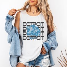 This Detroit Football shirt has a retro vibe with a fun Lions Football inspired graphic. Celebrate Football Season with game day shirt that you will want to wear on repeat. Comfort Colors are the most popular and trending shirts right now. This shirt will soon be your favorite with fabric created to be softer and feel broken in. The elevated dyeing process reduces shrinking up to 99% and the shirt is made from 100% ring spun cotton. - M A T E R I A L S - 100% Ringspun US cotton Medium fabric (6. Casual Sleeveless Tank Top For Game Day, Casual Sleeveless Muscle Tee With Screen Print, Sleeveless Graphic Print Top For Game Day, Sleeveless Letter Print Top For Game Day, Casual Sleeveless Tops For Game Day, Sleeveless Cotton Tops For Game Day, Game Day Cotton Graphic Tank Top, Game Day Cotton Tank Top With Graphic Print, Game Day Sleeveless Tank Top With Letter Print