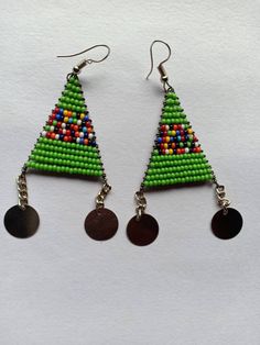 Handmade Beaded Earrings - Colorful, Lightweight, and Stylish! ✨ 🌿 Features: **Handcrafted: Each pair is meticulously made using high-quality seed beads. **Boho-Inspired Design: Ideal for those who adore bohemian, festival, or earthy styles. **Lightweight & Comfortable: Perfect for everyday wear or special occasions without causing discomfort. **Vibrant Colors: Choose from a variety of colors to match any wardrobe. **Perfect Gift: Great for birthdays, anniversaries, or as a thoughtful gift for Green Dangling Beads Earrings For Festivals, Beaded Chain Earrings As Gift, Beaded Chain Earrings With Round Beads For Gifts, Green Polished Bead Earrings, Traditional Polished Beaded Earrings For Gifts, Green Earrings With Polished Round Beads, Polished Bead Earrings For Festivals And Gifts, Festival Earrings With Polished Beads As Gift, Festival Earrings With Polished Beads For Gifts