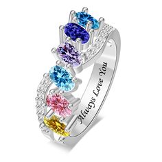 three stone ring with the words love is always surrounded by multicolored cubicles