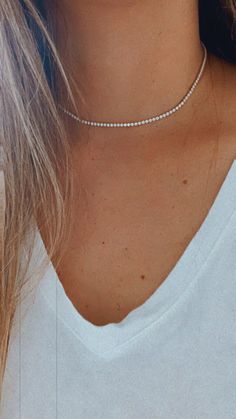 Cubic Zirconia Tennis Necklace | 14K Gold Filled | 2.2 MM Diamond Tennis Choker Necklace | Bridal Jewelry | Dainty Minimalist Necklace ------------------------------------------------- ♦ --------------------------------------------------- Beautiful Tennis choker necklace. It compliments any outfit. A wonderful gift for yourself or for any loved one and friend - purchase one today!♦ Materials: 18K Gold Filled ♦ Available colors: Gold ♦ Necklace measurements: the total length is 15.5" and the ston Dazzling Cubic Zirconia Jewelry With Delicate Chain, Dainty Crystal Diamond Necklace With Accents, Dainty Round Cubic Zirconia Tennis Necklace, Dainty Diamond White Necklace With Sparkling Stones, White Diamond Choker Necklace, Delicate Cubic Zirconia Diamond Necklace With Clavicle Chain, Dainty Diamond White Crystal Necklace, Dainty White Diamond Crystal Necklace, Dainty White Crystal Diamond Necklace