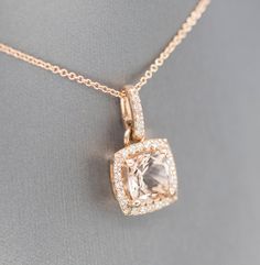 "Handcrafted Morganite and Diamond Halo 14k Rose Gold Pendant Necklace, Wedding Necklace, Bridesmaid Gift, Blush Pink Rose Gold, Gift for Her This sparkling handmade pendant necklace looks gorgeous in its rose gold setting, perfect for any occasion. The piece features a 2.70ct cushion Morganite as the main stone, which has a halo of 0.37ctw diamonds framing it. All stones are prong set in 14k rose gold, with small diamond accents on the gallery. The bale is locked in place so the pendant does no Refined Wedding Pendant Jewelry, Rose Gold Wedding Necklace With Diamond Accents, Rose Gold Diamond Accent Wedding Necklace, Elegant Rose Gold Morganite Jewelry, Refined Wedding Necklace With Pendant, Rose Gold Wedding Necklaces With Diamond Accents, Wedding Rose Gold Necklace With Diamond Accents, Formal Cushion Cut Morganite Jewelry, Refined Wedding Pendant Necklace