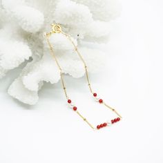 Handmade red coral and seed pearls bracelet in gold filled with a delicate design. We have a passion for ocean gemstones because water is the origin of life. A designer touch as an everyday elevation. It will add an elegant and delightful touch to any look. ⚜ Specs❀ Gold Filled Chain and Extenstion; Gold Plated Clasp❀ Red Coral Dyed from Natural White Coral❀ 6 Seed Pearls❀ Length: 18 - 21cm (7-8 Inch) Adjustable Elegant Red Coral Beaded Bracelets For Gift, Elegant Red Coral Beaded Bracelet Gift, Elegant Adjustable Red Coral Bracelet, Elegant Red Coral Adjustable Bracelet, Gold Red Coral Bracelets As Gift, Gold Red Coral Bracelet As A Gift, Gold Bracelets With Red Coral As Gift, Elegant Red Coral Beaded Bracelets With Adjustable Fit, Gold Red Coral Bracelets For Gifts