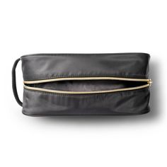 Add functional flair to your travel gear with this sleek and stylish Classic Travel Makeup Bag from Sonia Kashuk™ to take care of all your cosmetic and beauty accessories. The bold black hue and exposed zippers in a champagne gold tone along the top and side lend a chic, modern vibe to your cosmetic collection. Sporting a wide, spacious main compartment, this bag stows away makeup and other accessories in one convenient spot, keeping your suitcase or tote free of clutter. The fabric handle at th Elegant Cosmetic Bag With Zipper Closure For On-the-go, Elegant Cosmetic Bag With Zipper For On-the-go, Modern Travel Cosmetic Bag With Zipper Pocket, Versatile Black Cosmetic Bag For Travel, Versatile Travel Cosmetic Bag With Zipper, Versatile Cosmetic Bag With Zipper Pocket For Travel, Versatile Travel Cosmetic Bag With Zipper Pocket, Everyday Black Cosmetic Bag With Luggage Sleeve, Black Cosmetic Bag With Luggage Sleeve For Everyday