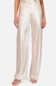 Fall for the sleek silhouette of these night-out pants designed with a high waist and crafted from glossy satin. 31" inseam; 21 1/2" leg opening; 11 1/2" front rise (size Small) Unlined 73% acetate, 27% polyester Dry clean Imported White Satin Pants Outfit, White Satin Pants, Cami Nyc, Satin Pants, Silk Trousers, Womens Cami, Trouser Pants Women, Maternity Shops, Pants Design