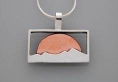 This simple yet striking mixed metal mountain pendant is inspired by the autumn season and harvest moon rising. Silhouetted silver peaks stand in front of a contrasting copper moon rise. This mountain necklace is a wonderful addition to anyone's mixed metal jewelry collection- and a great gift for those who love the mountains. A landscape pendant for any occasion. Keeping wild places close to your heartSize: 1" across and 7/8" long including the bailMaterials: sterling silver, and copper. The ch Sweat Soldering, Design Overlay, Mixed Metal Necklace, Mixing Metals, Mountain Jewelry, Mountain Necklace, Mountain Design, Metal Smithing, Moon Rising