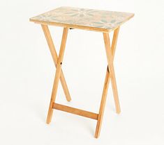 a small wooden table sitting on top of a white floor