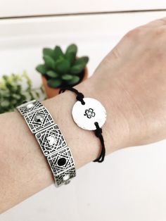 "This listing is for a boho style hand-stamped Four Leaf Clover charm with hammered edges on an adjustable hemp cord and that makes a great layering or stand-alone bracelet or anklet. Dainty and lightweight, designed for everyday wear. The bracelet comes with an inspirational card with the Four Leaf Clover Quote- \"Legend has it that each leaf on a four-leaf clover has its own meaning; the first is hope, the second for faith, the third is love and the fourth, if you can find one, is for luck!\" Bohemian Nickel-free Friendship Bracelets As Gift, Adjustable Symbolic Friendship Bracelets, Symbolic Adjustable Bracelets For Festivals, Bohemian Silver Friendship Bracelets With Sliding Knot, Adjustable Silver Friendship Bracelets, Adjustable Symbolic Bracelets For Festivals, Bohemian Silver Friendship Bracelet With Sliding Knot, Adjustable Symbolic Bracelets For Festival, Adjustable Silver Friendship Bracelet