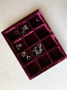 an assortment of rings in a velvet box