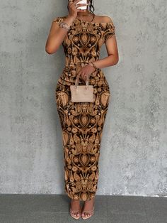 a woman standing in front of a wall holding a cell phone up to her face