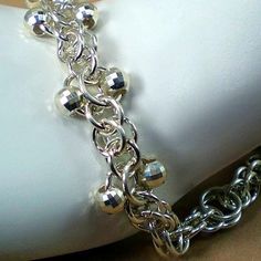 "This handmade chainmail bracelet is unlike any other chainmail bracelet.  The sterling silver mirror beads combined with the shimmer of Argentium sterling silver capture the light and make this bracelet shine as if you were wearing diamonds.  Great anniversary or valentine's day gift for a special woman.  Make it a set and pair it with the matching earrings available at https://www.etsy.com/listing/16555648/chainmaille-earrings-in-argentium-ooak?ref=shop_home_feat_2&frs=1 ╫ Ladies: Great way to Mirror Beads, Chainmail Bracelet, Artisan Jewelry Handmade, Silver Mirror, Valentines Day Gifts For Her, Argentium Silver, Beads Bracelet, Valentine Gift, Buying Jewelry