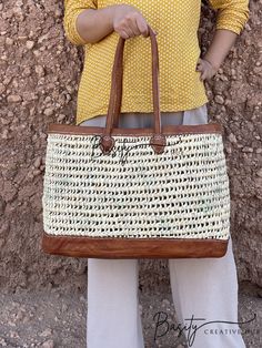 Prepare yourself for endless beach days and summer escapades with our chic Large Straw Beach Tote Bag. This versatile accessory is a must-have for beach enthusiasts and fashion aficionados alike. Expertly crafted from a fusion of straw and high-quality leather, this beach tote bag offers the perfect blend of durability and style. Its capacious interior provides ample space to stow all your essentials, from beach towels to sunscreen and more. Whether you're leisurely strolling along the coastline White Rectangular Bucket Bag For Beach Season, White Shoulder Beach Bag For Summer, White Shoulder Bag For Beach Vacation, White Shoulder Bag For Summer Travel, White Bucket Bag For Beach Season, Summer Rectangular Shoulder Bag For Travel, White Bucket Bag For Everyday Use During Beach Season, White Tote Bag For Beach, White Straw Satchel Bag For Beach