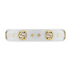 The Gucci Icon collection reprises one of the House's most emblematic motifs. The Interlocking G, representative of Founder Guccio Gucci's initials, is presented in 18k yellow gold, contrasting against a white synthetic corundum band. 18k yellow gold and white synthetic corundum Interlocking G engraving in gold .2" width This ring is a size 8 Made in Italy Gucci Style #: YBC679262002017 Gucci Silver Ring With Polished Finish, Gucci White Gold Luxury Ring, Gucci Luxury White Gold Rings, Gucci 14k Gold Designer Rings, Gucci Designer Rings In 14k Gold, Designer Gucci 14k Gold Rings, Luxury Gucci Round Ring, Luxury Gold Jewelry With Gold-tone Logo Plaque, Designer Yellow Gold Jewelry With Logo