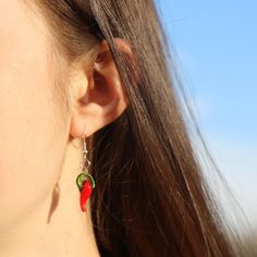 Do you want to spice up your outfit? Literally? Get these Red Chili Pepper Earrings or give them as the perfect gift. The drop length is around 1 3/4 inches (44.45 mm/4.445 cm) and the width is about 6/13 inches (11.72 mm/1.17 cm) but it may vary slightly on the charm. The earring hooks are made of a hypoallergenic metal and the chile charms are glass. Message us for customization requests (such as a replacement in metals) and we will see what we can do! These earrings would be the perfect gift (not to mention the packaging) and it would be a great stocking stuffer. Get the matching choker: https://www.etsy.com/listing/978635948/red-chili-pepper-choker?ref=shop_home_active_6 Casual Pierced Jewelry For Gifts, Casual Red Jewelry For Gifting, Casual Red Jewelry For Gifts, Casual Red Nickel-free Earrings, Pepper Earrings, Red Chili Peppers, Red Chili, Earring Hooks, Chili Pepper