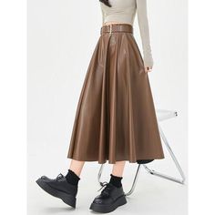 Discover Timeless Elegance Step into the world of sophistication and style with our Elegant High-Waist Faux Leather Skirt. This exquisite piece, perfect for the autumn and winter seasons, combines elegance with a contemporary twist, making it a must-have for your wardrobe. Crafted for the modern woman, this skirt is not just a garment; it's a statement of style and confidence. Product Features Our skirt boasts a classic A-line silhouette, ensuring a flattering fit for all body types. The high wa Belted Skirt For Fall Workwear, Belted Skirt For Workwear In Fall, Fall Workwear Belted Skirt, Fall Office Belted Skirt, Chic Faux Leather Pleated Skirt, Fitted Belted Skirt For Fall, Fall Formal Belted Skirt, Fall Flared Skirt Bottoms With Belt, Fall Belted Flared Skirt