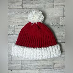 This Hat Is Fitted For The Size Of An Adult. It Is Made With Red Yarn And Topped With A White Pom-Pom. It Is Machine Washable (Machine Was Cold And Air Dry). Red Yarn, Winter Accessories, Handmade Accessories, Air Dry, Knitted Hats, Caps Hats, Pom Pom, Winter Hats, Accessories Hats