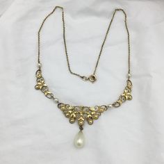 Vintage Deco 1920s to 1930s signed Andreas Daub A*D Germany rolled gold and costume white pearl ornate chain necklace. Lovely. In good condition. Weight 8g. Length 16.5 inch or 42cm possibly a little more room as the design dips down slightly (necklace extenders available) gold work 16mm widest and pearl bead drop 13mm x 8mm widest. Guaranteed vintage Art Deco Andreas Daub rolled gold Germany and in good condition and returnable if not delighted. Box not included. But do have some to sell if nee Necklace Extender, Gold Work, White Pearl, Vintage Art Deco, Pearl Beads, Pearl White, Chains Necklace, Vintage Art, Chain Necklace