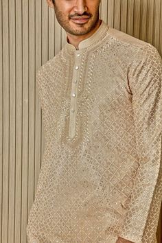 Beige tussar silk kurta with tonal resham, lurex, zari, and sequin embroidery in floral jaal patterns. Comes with pyjama. - Aza Fashions Embroidered Slub Silk Sherwani For Eid, Eid Embroidered Slub Silk Sherwani, Festive Cotton Silk Bandhgala With Resham Embroidery, Festive Kurta With Resham Embroidery On Tissue Silk, Transitional Tissue Silk Kurta With Zari Work, Designer Embroidered Slub Silk Sherwani, Festive Tissue Silk Kurta With Zari Work, Festival Sherwani With Resham Embroidery In Slub Silk, Festival Slub Silk Sherwani With Resham Embroidery