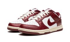 The Women’s Nike Dunk Low PRM “Team Red” is a women’s-exclusive colorway of the classic basketball shoe with an aged vibe.  The “Team Red” Dunk Low gives the popular and iconic silhouette a timeless appearance with a white leather upper contrasted with Team Red leather overlays and Swoosh branding on the sides.  “Nike” branding is found on both the tongue tag and heel.  A pre-aged midsole gives the shoe a decidedly vintage look.  Release date: April 21, 2023 Dunks Red, Dunks Burgundy, Burgundy Nike Dunks, Gym Red Dunks, Vintage Red Dunks, Sneaker Displays, Dunk Low Nike, Womens Red Shoes, Sneakers Box