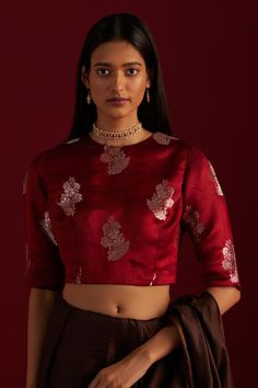 Red round neck blouse with floral brocade woven motifs. Components: 1 Pattern: Woven Type Of Work: Floral Neckline: Round Sleeve Type: Half sleeves Fabric: Brocade, Lining: Shantoon Color: Red Other Details:  Length: 5.5 mtrs Model height: 5ft 9inches, wearing size M Note: Blouse worn by the model is not for sale Disclaimer: Since all our products are sustainable, touched by human hands be it weaving, block printing, or embroidery, there might be slight imperfections that make them unique and in Red Saree Blouse, Saree Blouses Online, Banarasi Brocade, Round Neck Blouse, Women Saree, Brocade Blouses, Fancy Blouses, Fancy Blouse Designs, Blouse Designs Latest