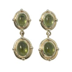 Mazza Peridot Oval Cabochon Double Drop 14K Yellow Gold Earrings Luxury Green Oval Cabochon Earrings, Luxury Drop Cabochon Earrings, Luxury Yellow Gold Cabochon Earrings, Luxury Oval Cabochon Jewelry With Prong Setting, Luxury Jade Cabochon Earrings, Luxury Marquise Cabochon Jewelry, Luxury Green Cabochon Earrings, Luxury Gold Cabochon Earrings, Luxury Gold Cabochon Pearl Earrings