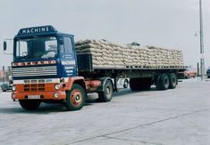 a large truck is loaded with sand bags