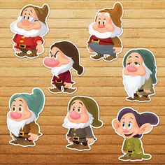 the snow white and the seven dwarfs stickers are on a wooden surface with wood flooring