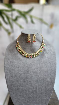 Very Gorgeous and elegant stone choker in antique gold with matching earrings Versatile. Can be paired with number of outfits.Perfect to wear at weddings occasions. Multicolor Gold Plated Kundan Necklace With Meenakari, Multicolor Meenakari Kundan Necklace Gold Plated, Festive Multicolor Gold Plated Bridal Necklace, Festive Multicolor Gold-plated Bridal Necklace, Elegant Multicolor Kundan Lehenga, Gold Plated Kundan Necklace Bollywood Style For Party, Bollywood Kundan Necklace For Party, Gold Plated, Bollywood Style Gold Plated Kundan Necklace For Party, Festive Gold-plated Hand Set Kundan Necklace