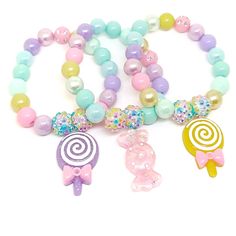 These adorable bracelets are the perfect favor for your little one's candy themed party! Each bracelet features a bright rainbow swirl clay lollipop charm, resin rhinestone beads and an assortment of bright rainbow 10mm acrylic beads strung with durable stretch cord. Each bracelet will arrive individually packaged in organza bags. Please select the number of bracelets and bracelet size needed from the drop down menu. Please message me if you have any questions. To be the first to know about new Colorful Cute Party Jewelry, Cute Multicolor Charm Bracelet For Parties, Playful Colorful Jewelry For Birthday, Colorful Playful Birthday Jewelry, Playful Hypoallergenic Party Jewelry, Playful Hypoallergenic Jewelry For Party, Multicolor Novelty Party Supplies For Gifts, Kawaii Multicolor Party Jewelry, Rainbow Novelty Jewelry For Birthday