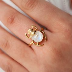 This beautiful ring is made in Sterling Silver and coated with a thick layer of 24K Yellow Gold to a Gold Vermeil thickness and set with a natural Moonstone. 24K Gold Vermeil jewelry is not only hypoallergenic, but it also does not tarnish.  Your ring is meticulously handcrafted and hand-polished to perfection. It is made to last a lifetime with proper care. This is a unique piece of minimalist jewelry for everyday wear.  Please note: Due to the one-of-a-kind nature of the gemstone, exact colors and patterns may vary slightly from the image shown. PLEASE REVIEW THESE INSTRUCTIONS TO LEARN ABOUT HOW TO PROPERLY CARE FOR YOUR JEWELRY.  To properly store your jewelry, store your jewelry in the jewelry bag, and place the jewelry bag in your jewelry box. Doing so will protect and improve the qu Ring Sizing Chart, To My Future Husband, Autumn Looks, Ear Climbers Earrings, Wearable Art Jewelry, Garnet And Gold, Gold Vermeil Jewelry, Ear Cuff Earings, Vermeil Jewelry