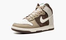 The Nike Dunk High ‘Light Chocolate” is an appealing earth-toned colorway of the vintage basketball shoe that was released in August 2021.  Versatile in “Light Chocolate,” this high-top Dunk features Sail-colored leather on the perforated toe that’s contrasted by Khaki leather overlays on the toe cap, forefoot, and eyelets.  The mid-panel, collar, and heel appear in Light Chocolate suede.  A Sail leather Swoosh logo appears on the sides and a light grey suede overlay is found on the heel.  Contr Chocolate Shoes, Meds For Dogs, Vintage Basketball, Nike Dunk High, Dunk High, Swoosh Logo, Grey Suede, Colored Leather, Nike Cortez Sneaker