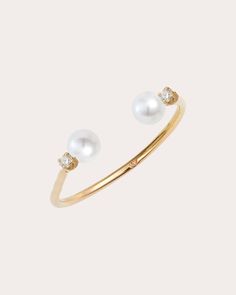 Set atop an open-ended band, this 14-karat gold ring is capped with genuine freshwater pearls and round-cut diamond accents for iridescent shine. 14k yellow gold, freshwater pearl and diamond Diamond carat: 0.06 ctw Diamond color: F Diamond clarity: VS Polish with soft cloth Handmade in Canada Measurements Band width: 1.3mm Sustainability Metrics: Circular Economy: product is intentionally designed with 50% of actively cycled materials Conflict-Free: 100% of products are recycled or conflict-fre Open Pearl Ring, Baby Pearls, Pearl And Diamond Ring, Circular Economy, Diamond Carat, Open Ended, Women Diamond, Diamond Color, Open Ring