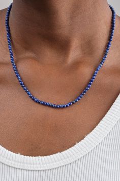 Beaded lapis lazuli necklace Unmistakably timeless gem in a deep and exquisite shade of blue Crafted to be worn alone or elegantly stacked Measures 18” 14k gold ball clasp Lapis is known for supporting spiritual enlightenment, diving into the inner world Ethically made in Los Angeles Necklaces sold individually Designer: Beatrice Valenzuela | Learn more about the Designer and shop the collection. Classic Blue Gemstone Necklace, Elegant Blue Hand-strung Beaded Necklaces, Timeless Blue Necklace For Gifts, Timeless Blue Necklace For Gift, Timeless Blue Necklace Perfect For Gifts, Blue Single Strand Jewelry For Formal Occasions, Elegant Single Strand Blue Jewelry, Blue Single Strand Formal Jewelry, Elegant Blue Single Strand Jewelry