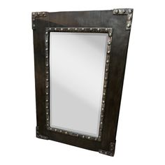 a mirror with rivets is shown on a white background