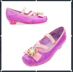 Sparkling, ''sugared glitter'' uppers Metallic faux leather bow and detailing on strap and heel Strap features self-stick fabric fastening Purple satin cord detailing Satin lining and footbed Golden Corona emblem with faceted gem in the center Textured non-slip soles 1/2'' low heel Part of our Rapunzel Costume Collection for Kids Inspired by Tangled: The Series   All man-made materials Imported Rapunzel Shoes, Crochet Baby Halloween, Bell Costume, Rapunzel Costume, Makeup Kit For Kids, Girls High Heels, Princess Toys, Costume For Kids, Sparkle Shoes