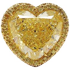 Specification :- Stone Details :- * Diamond Material : Cubic Zirconia (CZ) * Center Diamond Shape : Heart Cut * Total Diamond Weight : 14.45 CT ( Approx.) * Center Diamond Dimension : 16*15.8 MM * Center Diamond Weight : 13.75 CT  * Side Diamond Dimension : 1.80 MM * Diamond Weight : 0.70 CT  * Side Diamond Color : Yellow  * Clarity : VVS * Making Process : Handmade by our Experienced Staff. * Stamp : Our All Item Stamped According to metal Purity (925 SIL/10K/14K/18K). Custom Order :- * We do A Ring Heart Shape, Fancy Yellow Diamond Ring, Contemporary Engagement Rings, Yellow Diamond Rings, Fancy Yellow Diamond, Yellow Diamonds, Ring Heart, Diamond Halo Ring, Ring Halo