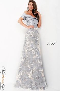 Indulge in elegance with the Jovani 02921 gown. Crafted from luxurious lace and taffeta, this A-Line masterpiece features a bateau neckline, short sleeves, and pleated skirt for added sophistication. Perfect for evening events, special occasions, and plus sizes. Elevate your style effortlessly. Gray Evening Gown, Formal Wedding Guest Dress, Evening Gowns With Sleeves, Formal Evening Wear, Mother Of Groom Dresses, Evening Dresses With Sleeves, Full Length Gowns, Wedding Designer, Mob Dresses