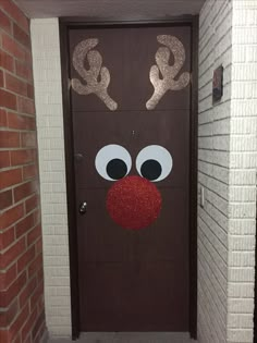 a door decorated to look like rudolph the reindeer