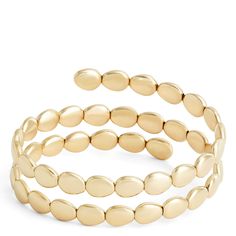 Our Toscano Collection celebrates gold’s lasting impact on style and creativity. We work with Italian artisans to bring you unique pieces that are as versatile as they are beautiful. This wrap bracelet is made with 14k yellow gold formed into beautiful beads that wrap around the wrist for an intriguing stacked look. Every piece from the collection pays tribute to generations of Italian gold jewelry making tradition combined with contemporary styling. Modern Gold-tone Round Bracelets, Adjustable Yellow Gold Bangle With Polished Finish, Gold Beaded Bangle Jewelry, Adjustable 14k Gold Bracelets For Fine Jewelry, Adjustable 14k Gold Bracelets Fine Jewelry, 14k Gold Jewelry With Bracelet Strap, Gold Stackable Beaded Bracelets Fine Jewelry, Modern Gold Jewelry With Oyster Bracelet, Adjustable Polished Yellow Gold Bracelet