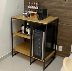 a wine rack with bottles on it next to a chair and coffee maker in the corner