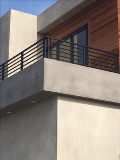 an apartment building with a balcony and balconies