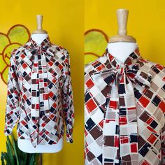 A B O U T Circa: 70s  Brand/Tag: No tag listed  Condition: Flaws/wear to be expected on all of our items. Our items are vintage, which means they are PRE-LOVED. Missing bottom button. Details: Vntg 70s Bow Tie Collared Blouse Geometric Checkered Pattern Print M/L  S I Z I N G    * ALL ITEMS ARE MEASURED FLAT * To find the circumference of a measurement, simply double. This will be your accurate size.  Any tags listed are considered "vintage sizing", so please make sure to check measurements for Fall Retro Blouse With Vintage Print, Retro Vintage Print Blouse For Fall, Retro Blouse With Vintage Print For Fall, Fall Retro Print Patterned Blouse, Retro Patterned Top With Vintage Design, Retro Long Sleeve Blouse For Vintage Fashion, Fall Retro Blouse, Fall Vintage Blouse With Vintage Pattern, Vintage Blouse With Vintage Pattern For Fall