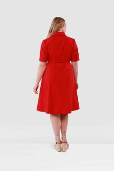 Turn heads with the Liliana Shirtdress by Gabriella Rossetti. Crafted from luscious tomato-red polished poplin cotton, this knockout features chic buttoned short sleeves and a fit-and-flare silhouette that’s as flattering as it is fabulous. Perfect for anything from a power lunch to a night out, the Liliana dress infuses your wardrobe with a burst of color and effortless elegance. Embrace the vibrant, joy-filled spirit of Gabriella Rossetti and make the Liliana dress your go-to for standout styl Formal Short Sleeve Cotton Midi Dress, Red Cotton Shirt Dress, Red Cotton Formal Dresses, Red Cotton Shirt Dress For Work, Red Short Sleeve Shirt Dress For Work, Short Sleeve Cotton Dresses For Office, Cotton Short Sleeve Office Dress, Short Sleeve Cotton Office Dress, Fitted Red Shirt Dress