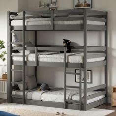 the bunk bed has two sets of ladders on each side and one set of stairs to the bottom