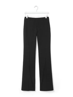 Meet our new menswear-inspired trouser: the Logan. These lightweight black wool trousers have a contoured waistband that molds to your body | Banana Republic Straight Silhouette Dress Pants With Belt Loops For Office, Straight Silhouette Pants With Belt Loops, Tailored Dress Pants With Belt Loops And Straight Silhouette, Business Casual Pants With Belt Loops And Straight Silhouette, Straight Hem Pants With Button Closure For Work, Sleek Fitted Straight Bottoms, Tailored Straight Pants For Work, Fitted Straight Leg Dress Pants With Button Closure, Office Pants With Welt Pockets And Straight Silhouette