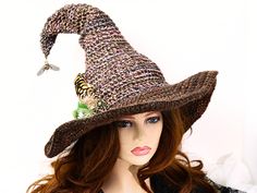 Ready for the Renfaire, a Steampunk festival, cosplay, a witch gathering, your table centerpiece, or just plain fun, this witch hat is firmly structured but soft to wear. Ready to navigate the forest or the sea, I've done this one with a bit of mariner steampunk and just a touch of forest. A steampunk style firefly dangles from the tip to light your way in the dark, with an octopus wrapped around an anchor at the base, and some ferns and feathers tucked behind. The way I stitch allows you to twist and shape or return it to straight up. The wired brim can also be shaped in any number of ways. When you're not wearing it, you can toss it on your table for a great conversational centerpiece, or hang it on a hook by the door! Folds flat for your travels. -This soft witchy hat has some stretch s Witch Gathering, Steampunk Magic, Nautical Steampunk, Witchy Hat, Steampunk Witch, Steampunk Festival, Wizard Hat, Magic Hat, Steampunk Style