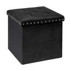 a small black ottoman with studded trimmings on the top and bottom side