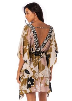 Let our Lilith kaftan go with you on your most relaxing days - this super-soft dress can be thrown on over your swimsuit or be with you as you dry off. Its kimono sleeves and Maajical print lend a sophisticated look to a very uncomplicated piece. Model Size and Measurement:Stephanie is wearing a size SMALL - Height: 5'7 (1.70 cm) - Bust: 32" (83 cm) - Waist: 26" (67 cm) - Hips: 35" (90 cm) Garment Features:V-neckKimono sleeveShort sleeveFunctional tie at waistDouble V neck lineEmbellished tassel Chic Printed V-neck Kaftan, Chic V-neck Printed Kaftan, Chic Printed Beach Kaftan, Chic V-neck Beach Dress For Loungewear, Chic V-neck Beach Dress, Tropical Print Beach Dress For Brunch, Floral Print Tunic With Kimono Sleeves For Vacation, Chic Summer Tunic With Kimono Sleeves, Chic Flowy Cover-up For Brunch