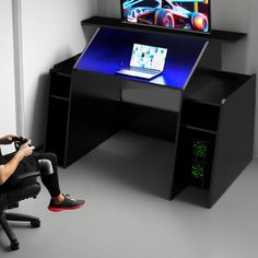 Transform your gaming setup into a powerhouse with the ultimate gaming desk - Nebula Gaming Desk. Engineered for performance and designed with gamers in mind, this desk is your ticket to domination on the virtual battlefield. Loft Bed Gaming Set, Gaming Desk Designs, Rgb Gamer Desk, Pc Gaming Setup Purple, Futuristic Gaming Console, Pc Gaming Setup Black And Purple, Kids Bedroom Furniture Design, Mens Room Decor, Decor Pad